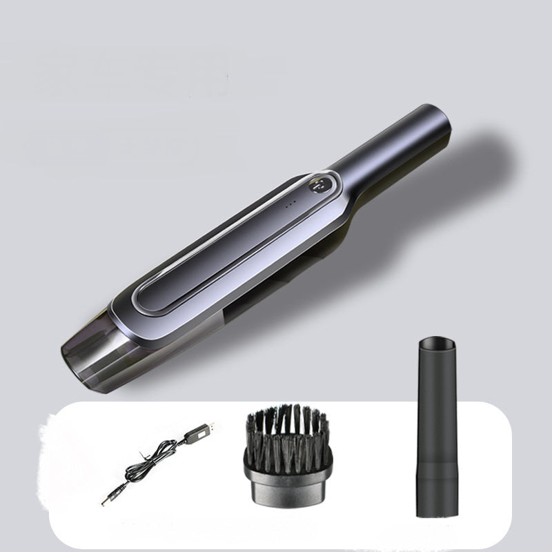 Portable handheld vacuum cleaner with brush and crevice tools, USB charging cable included