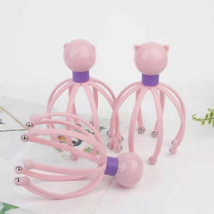Pink cat-head scalp massager with flexible silicone fingers and metal beads for relaxation